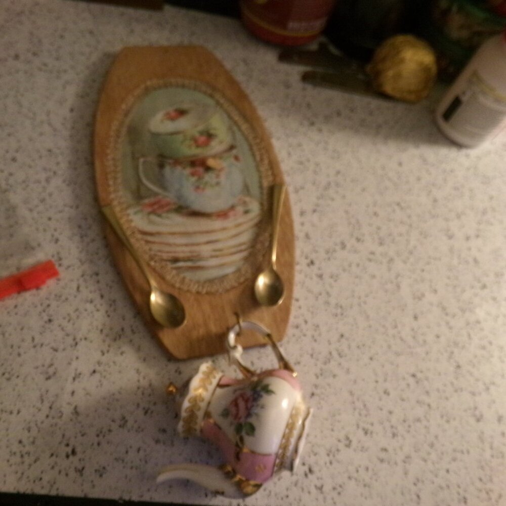 hand made decoration. wood and a Victoria garden tea pot  figure.